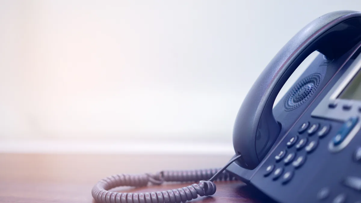 Office desk phones representing inbound sales leads from Google Ads