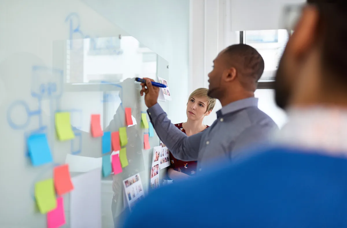 Marketing team weighing SEO against Google Ads during a strategy session