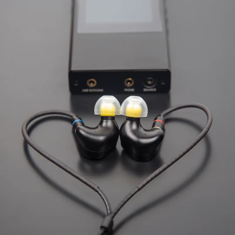 A balanced reference headphone amplifier on a dark bench