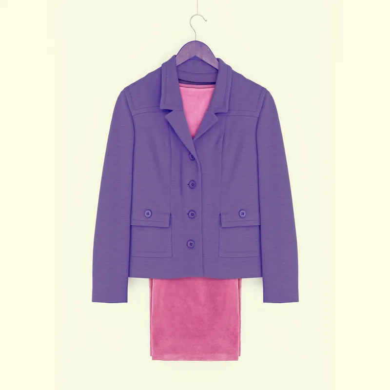 Atelier Blazer in soft jersey on a wooden hanger, layered over a knit top