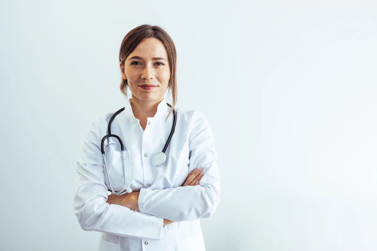 Dr. Eleanor Voss — portrait in a white coat with a stethoscope