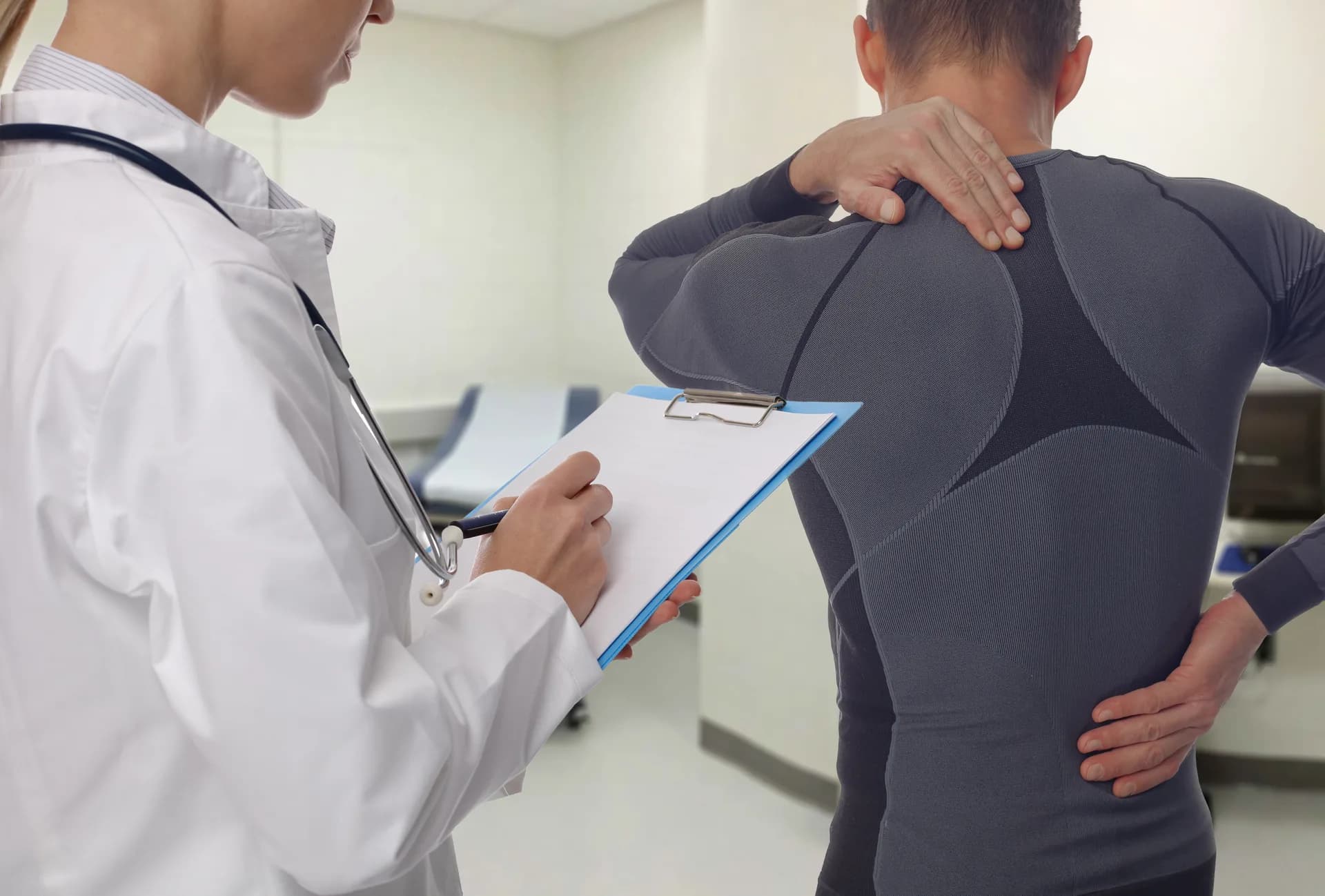 Physiotherapist treating a patient's lower back