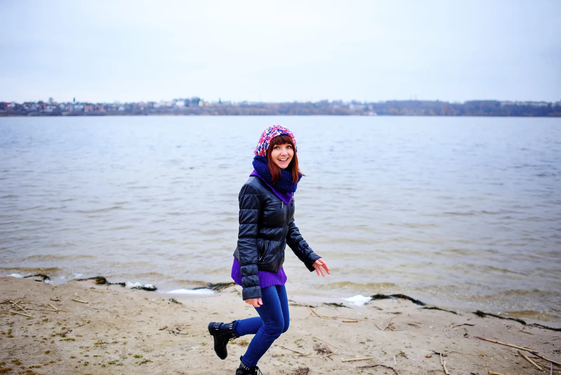 A runner moving freely along the beach