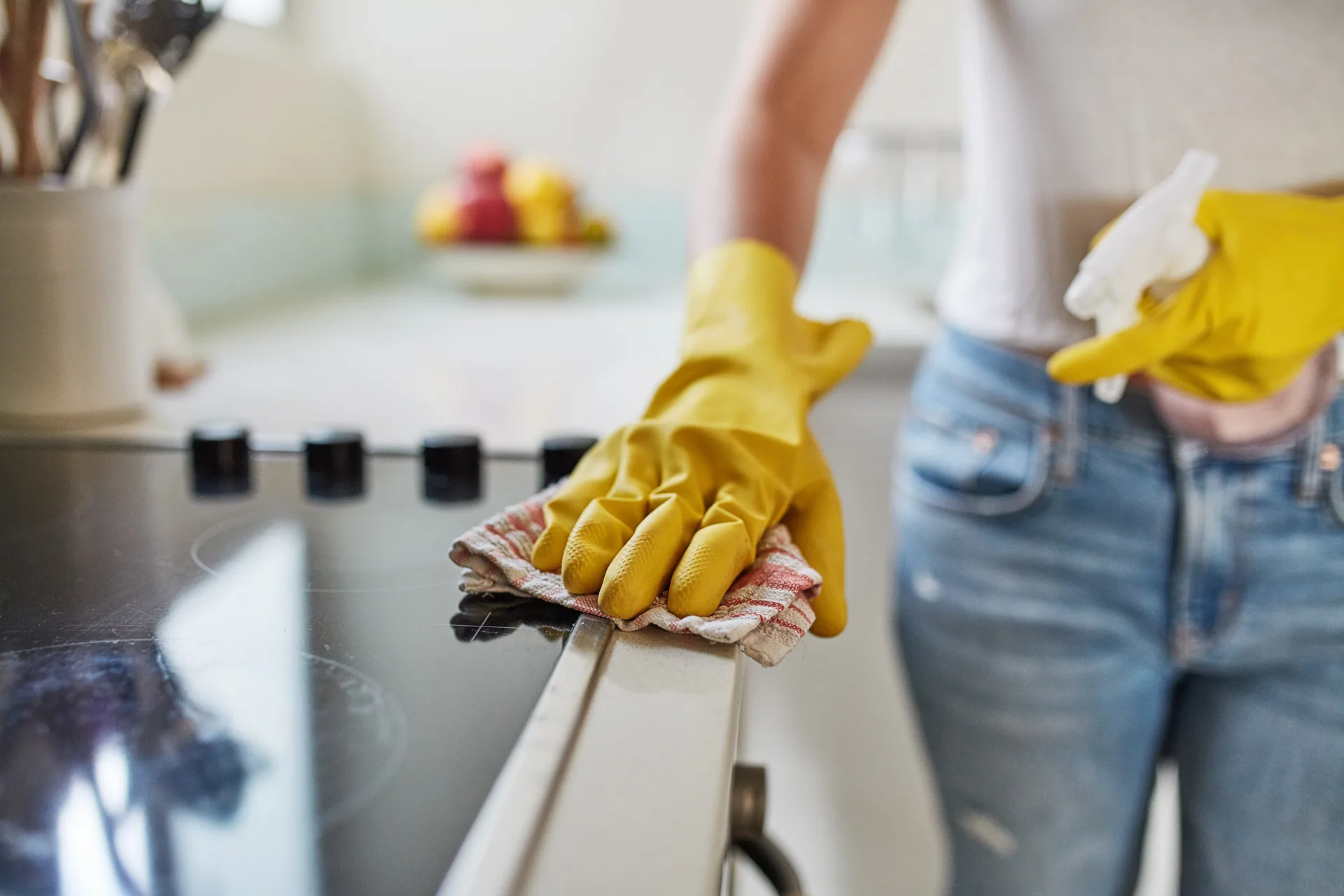 Pro cleaning a sun-lit kitchen counter