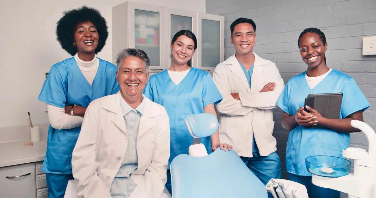 Dental team around a treatment chair