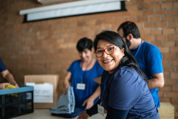 Volunteers working together to support a community cause