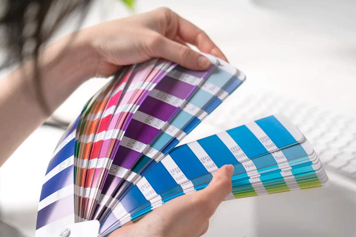 Graphic designer working with color swatches