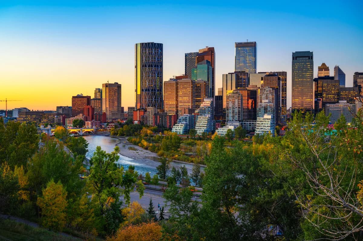 Calgary skyline at sunset over the Bow River, Alberta