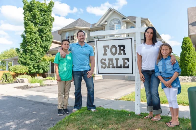 Couple receiving the keys to their newly financed home