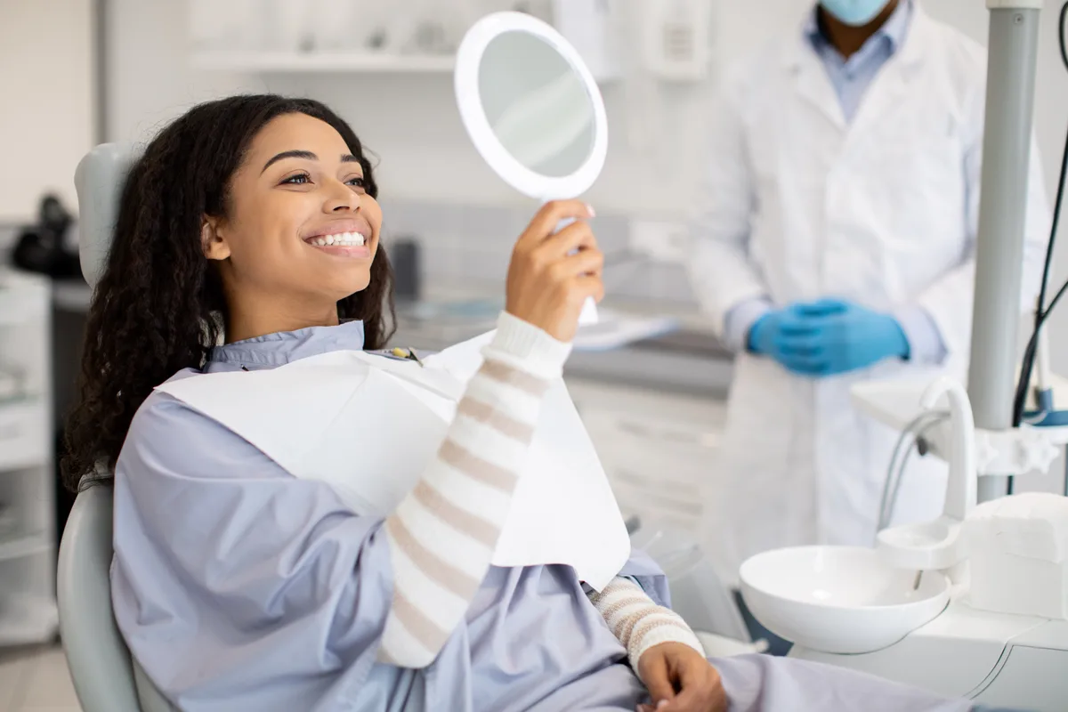 A relaxed patient smiling during a first visit at Northline Dental Co.