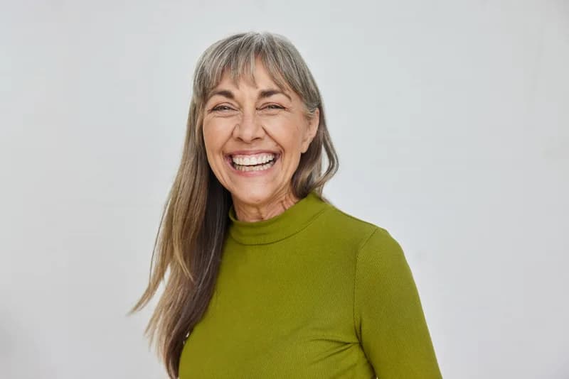 A happy patient smiling after specialist treatment at Meridian