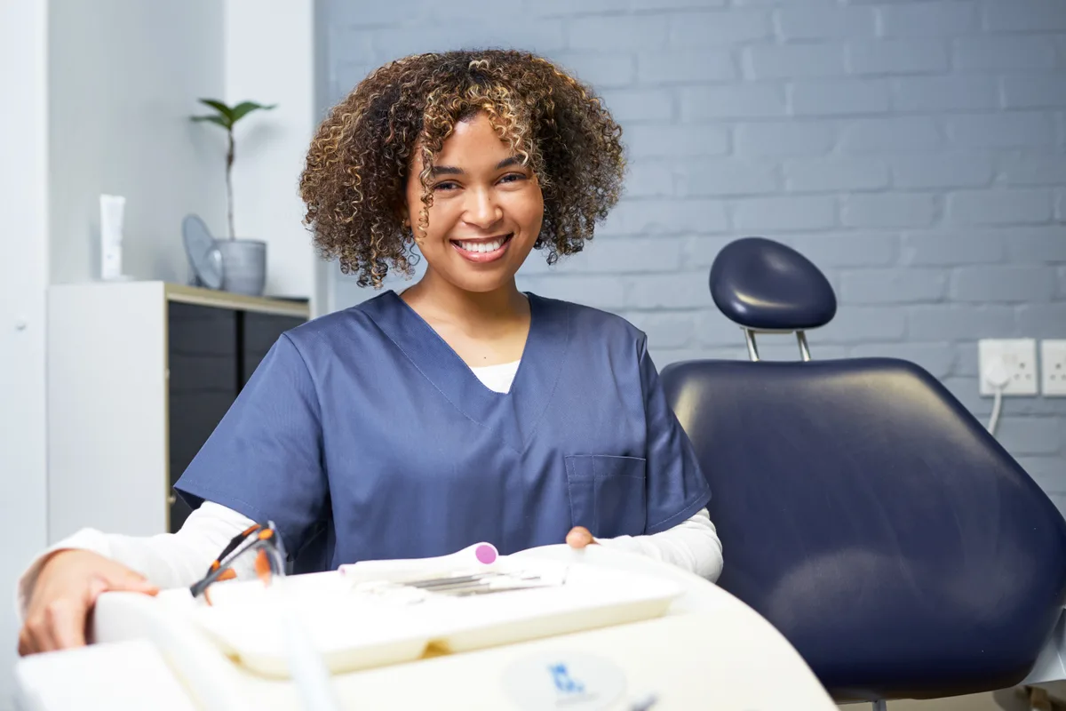 Dr. Elena Vance, lead dentist at Aura Dental Studio, in a modern dental office