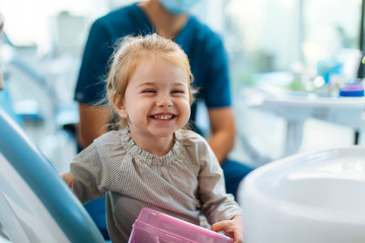 An Ora dentist performing a gentle whole-mouth assessment on a relaxed patient