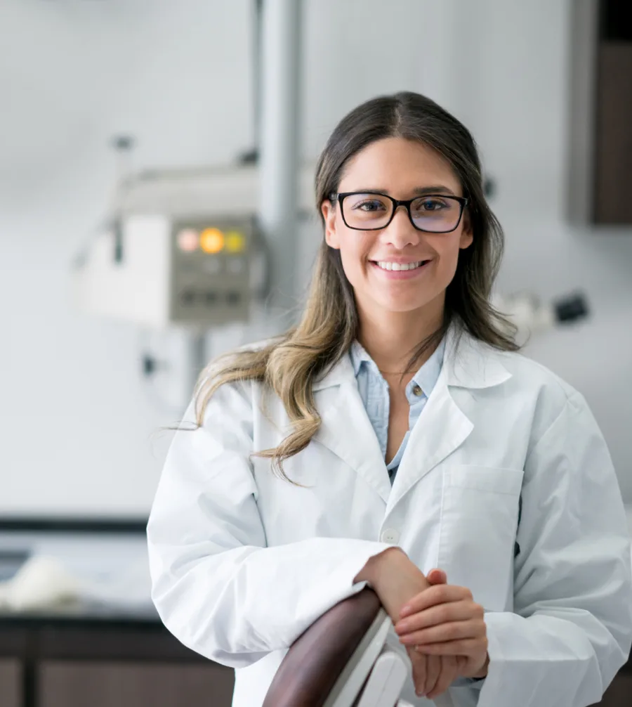Dr. Hana Okafor, lead dentist at Maple Family Dental, smiling in the practice
