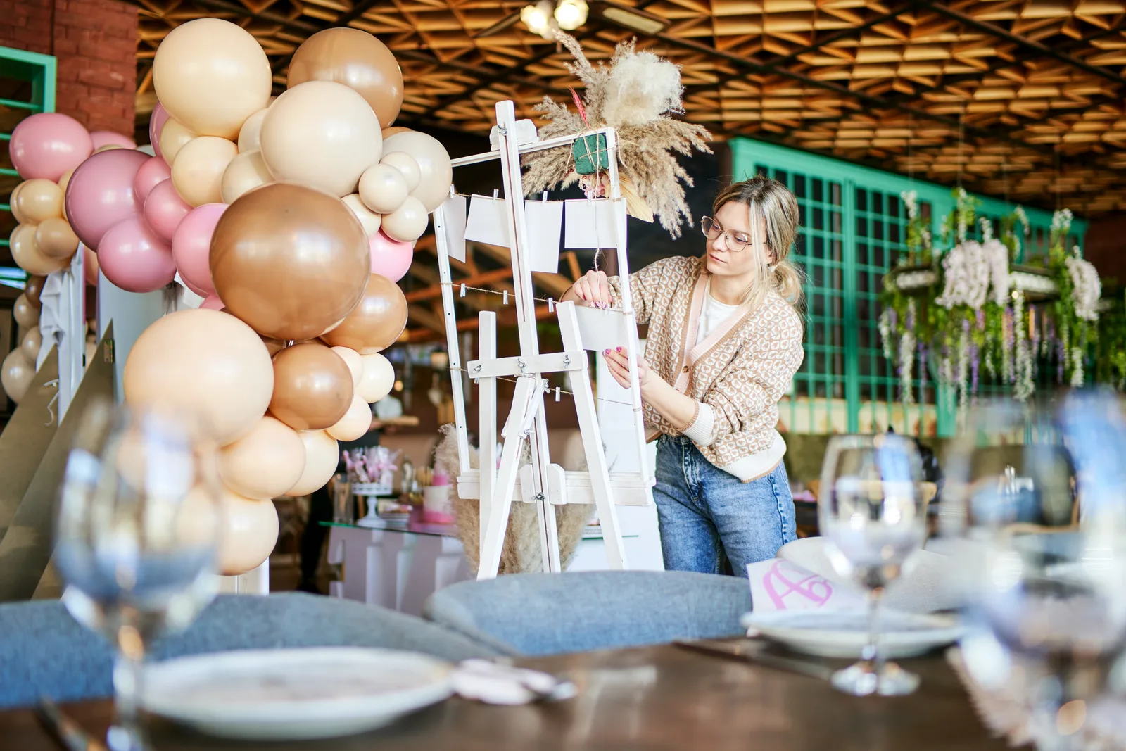 Event planner arranging decorations for an event