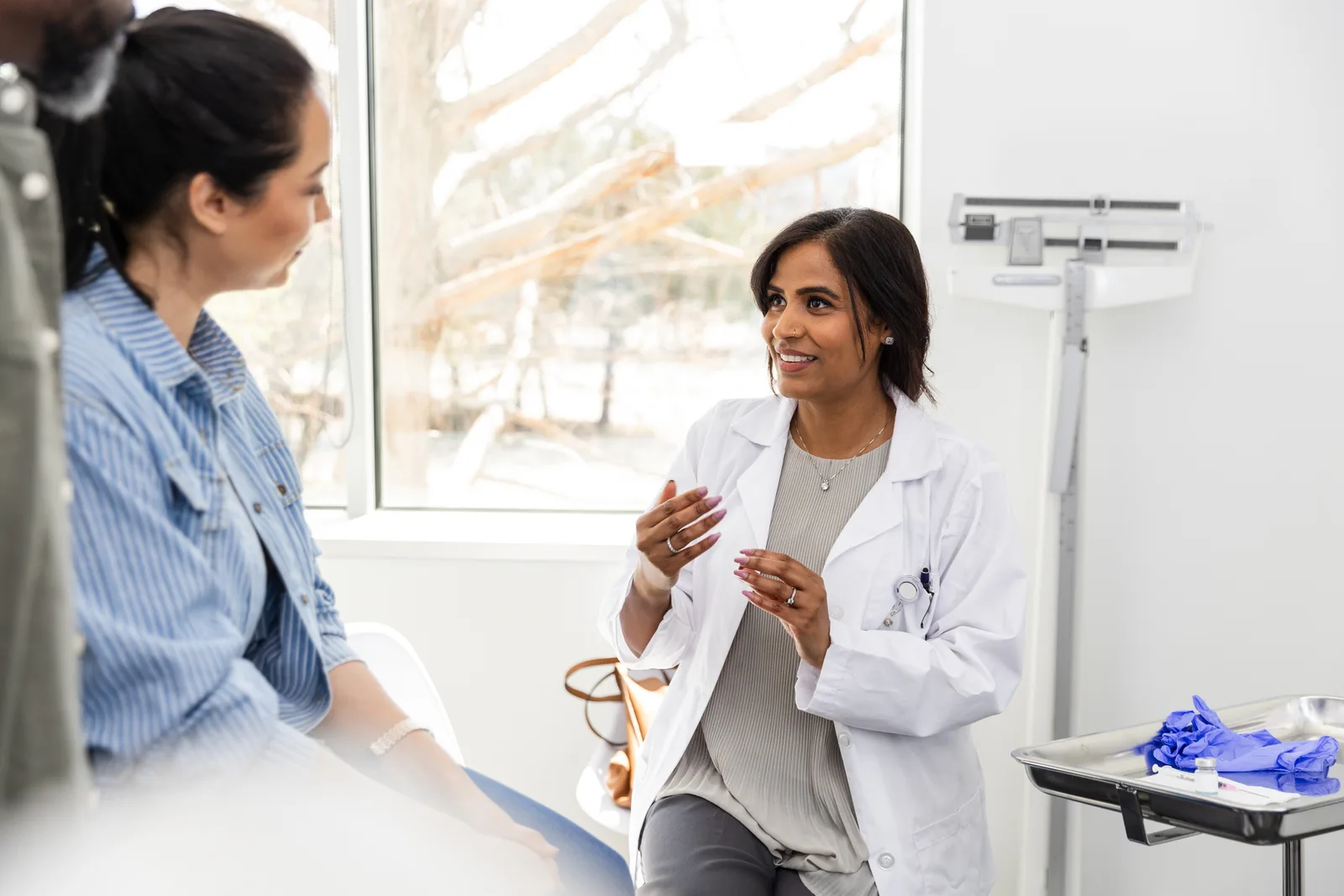 Hopeful couple consulting a fertility doctor about IVF treatment options