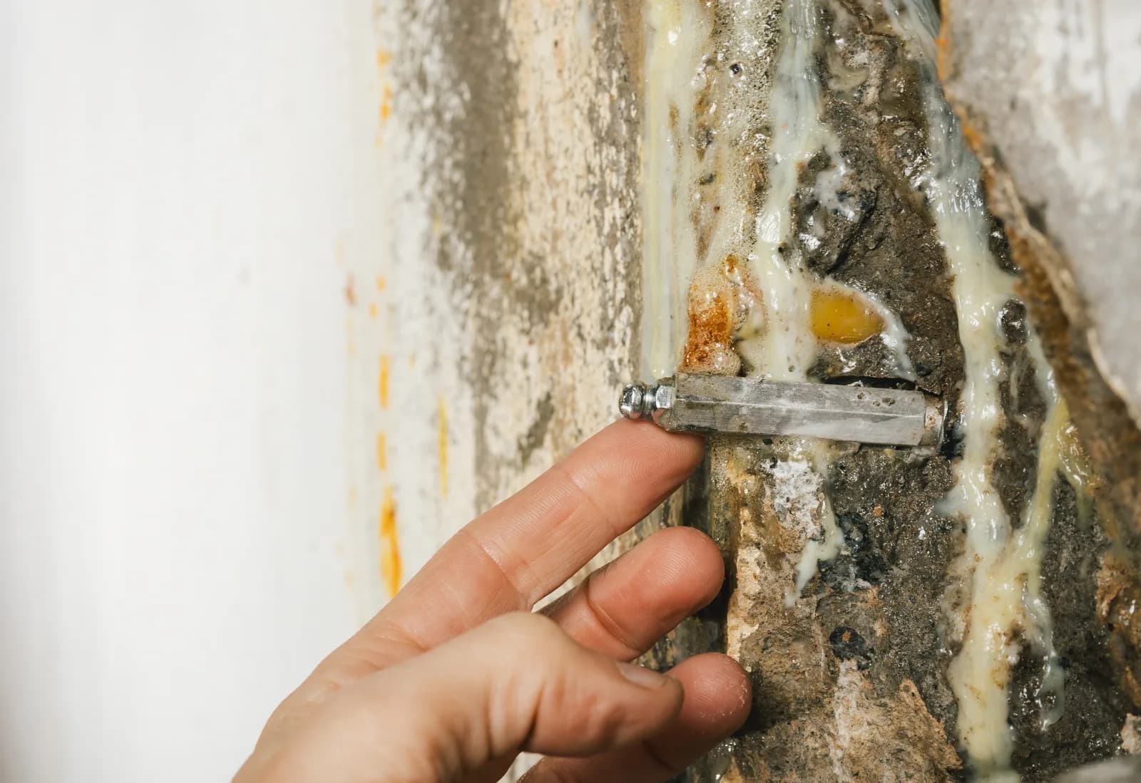 Engineer inspecting a foundation crack repair