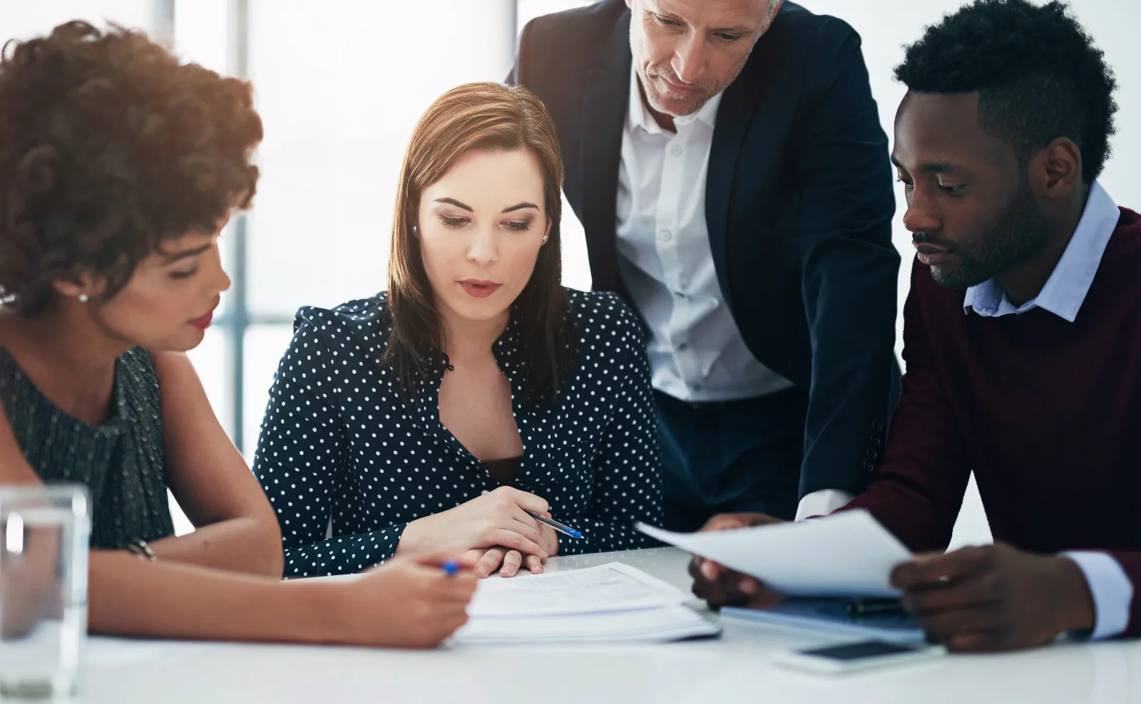 Legal team reviewing case documents at a law firm