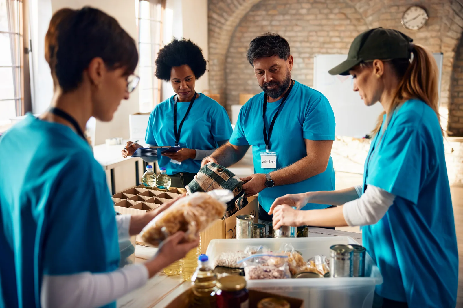 Volunteers packing donations together at a community food bank