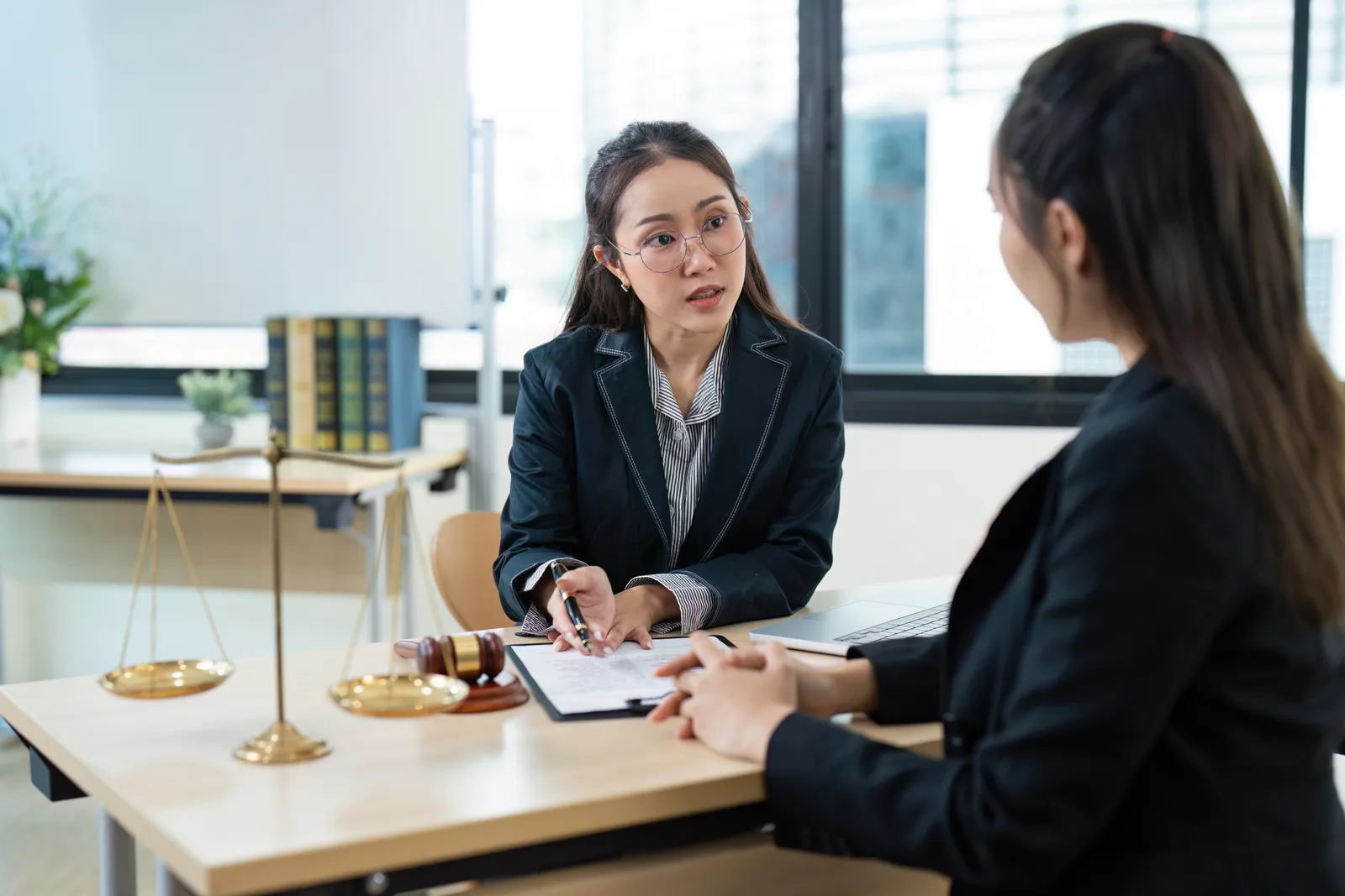 Personal injury attorney consulting with a client in a modern law office