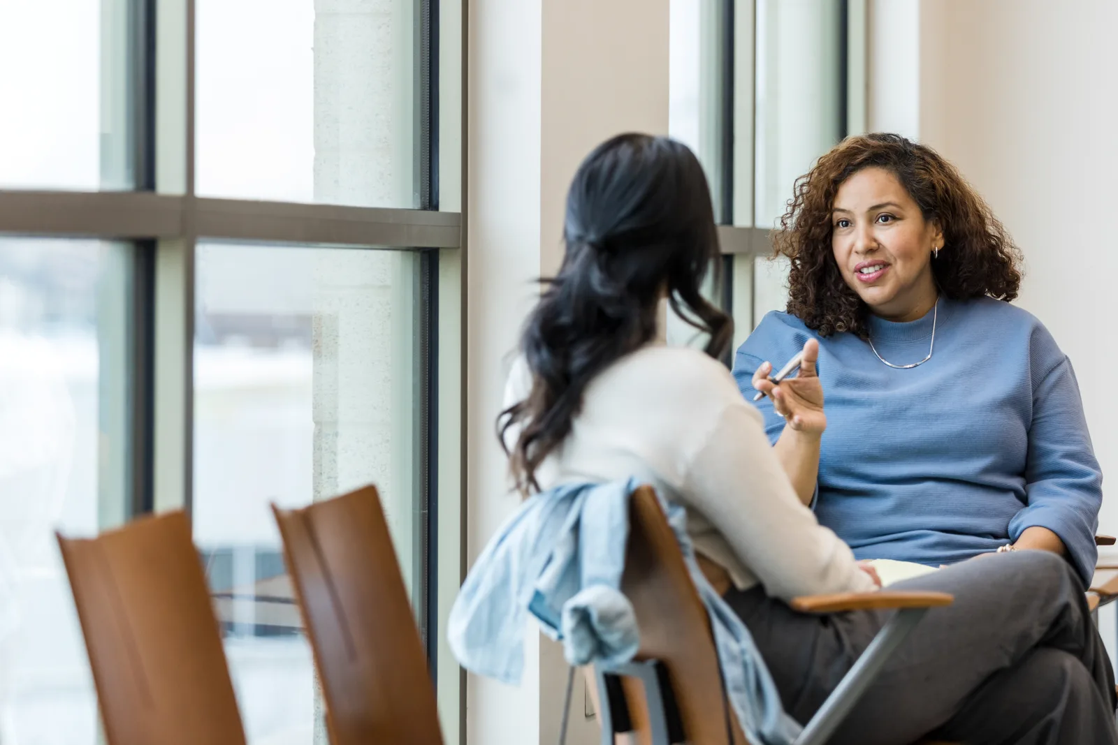 Therapist talking with a client during a counseling session