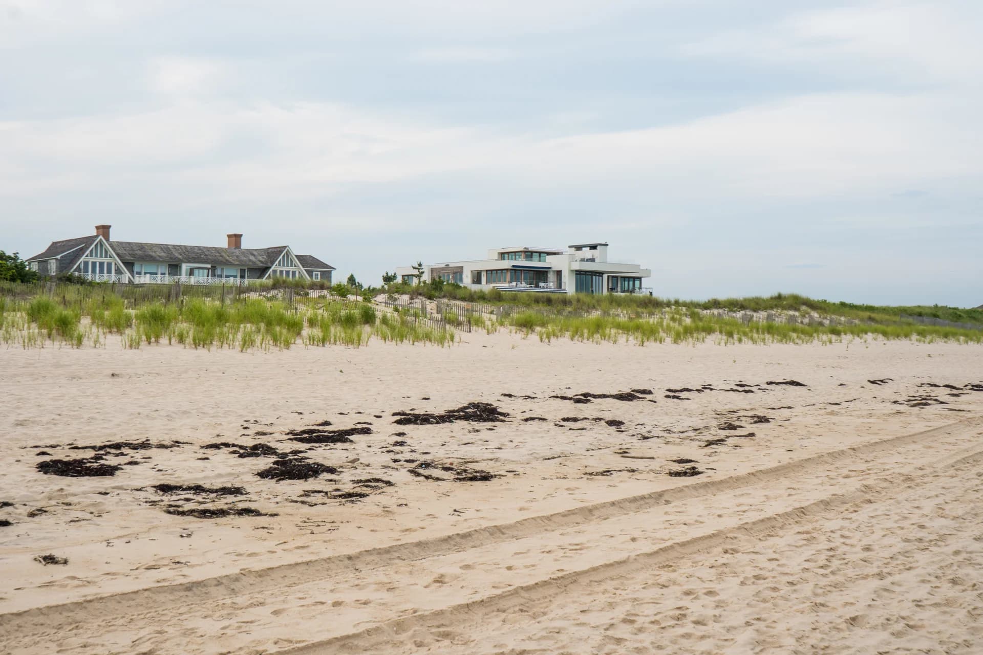 East Hampton shingle-style estate with mature trees and traditional landscaping.